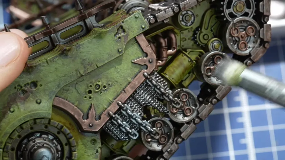 Dry brushing the metal wheels and chains on the tank side with a soft round brush, Episode 07